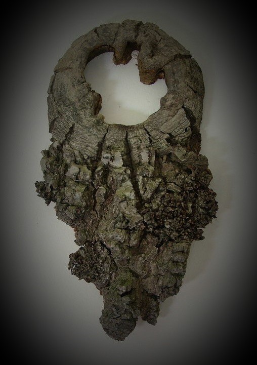 wall decoration of piece of wood with a hole in it.
